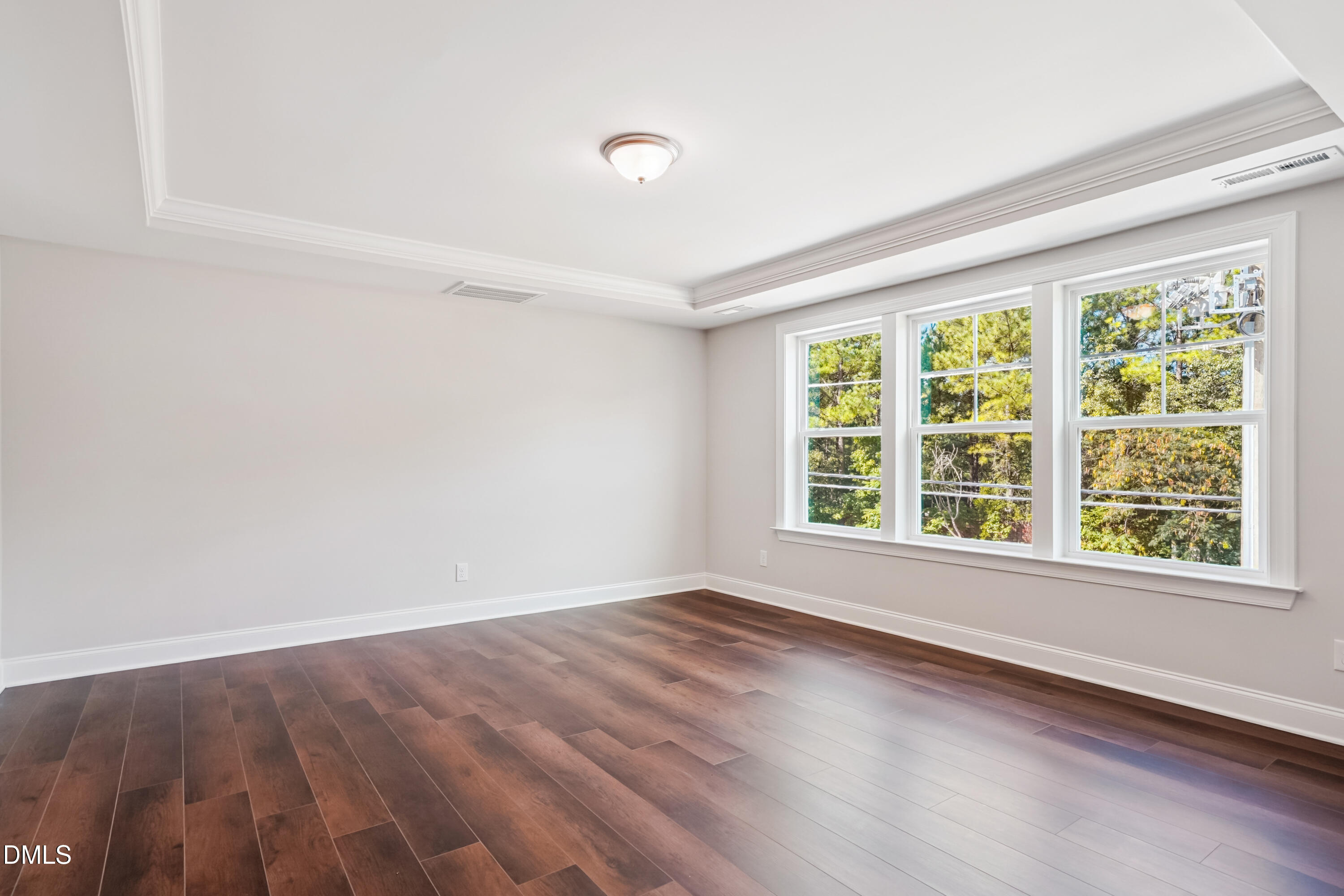 4921 Theater Way Raleigh, NC 27604 - Photo 24 of 26 a view of an empty room with wooden floor and a window