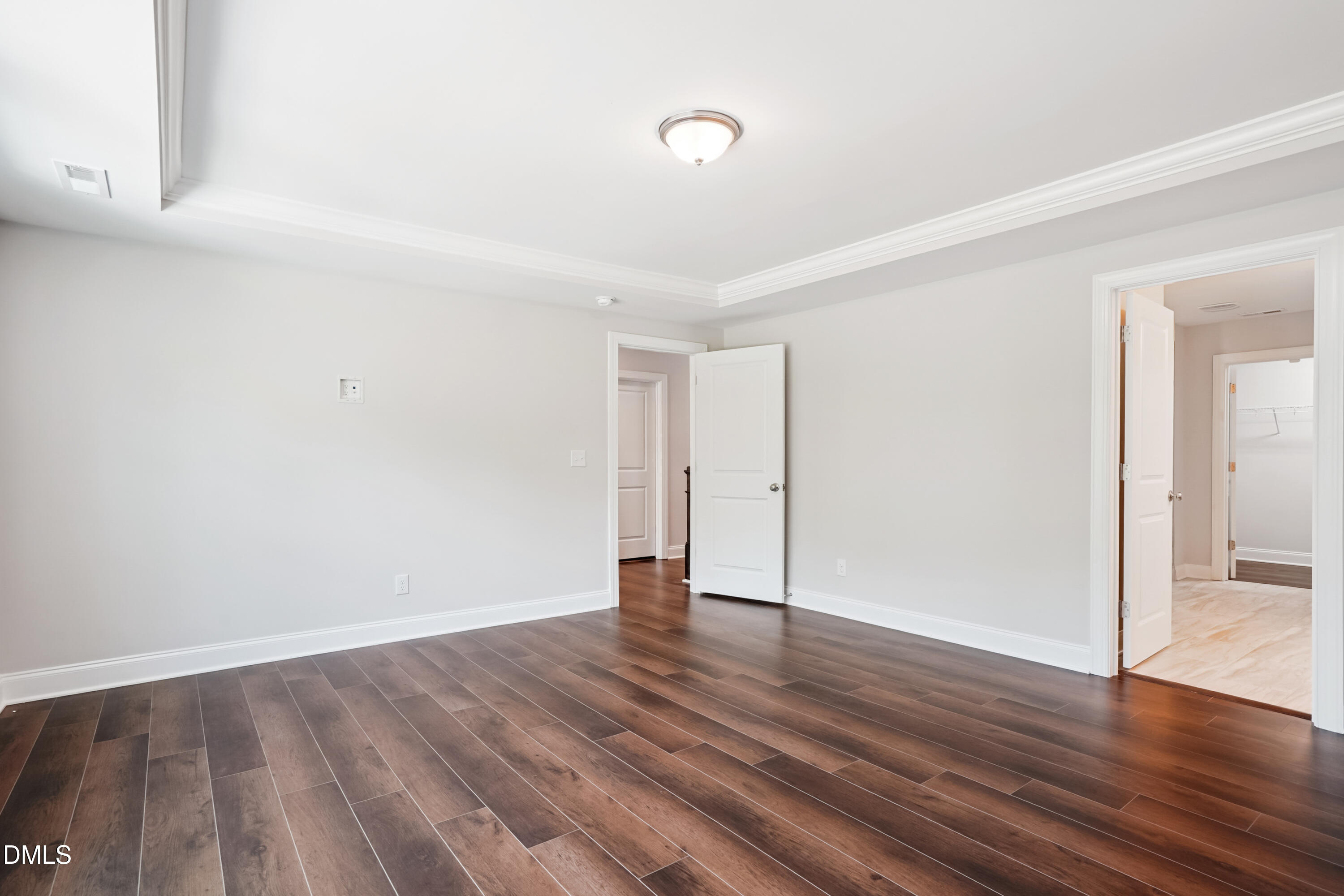4921 Theater Way Raleigh, NC 27604 - Photo 25 of 26 a view of an empty room with wooden floor