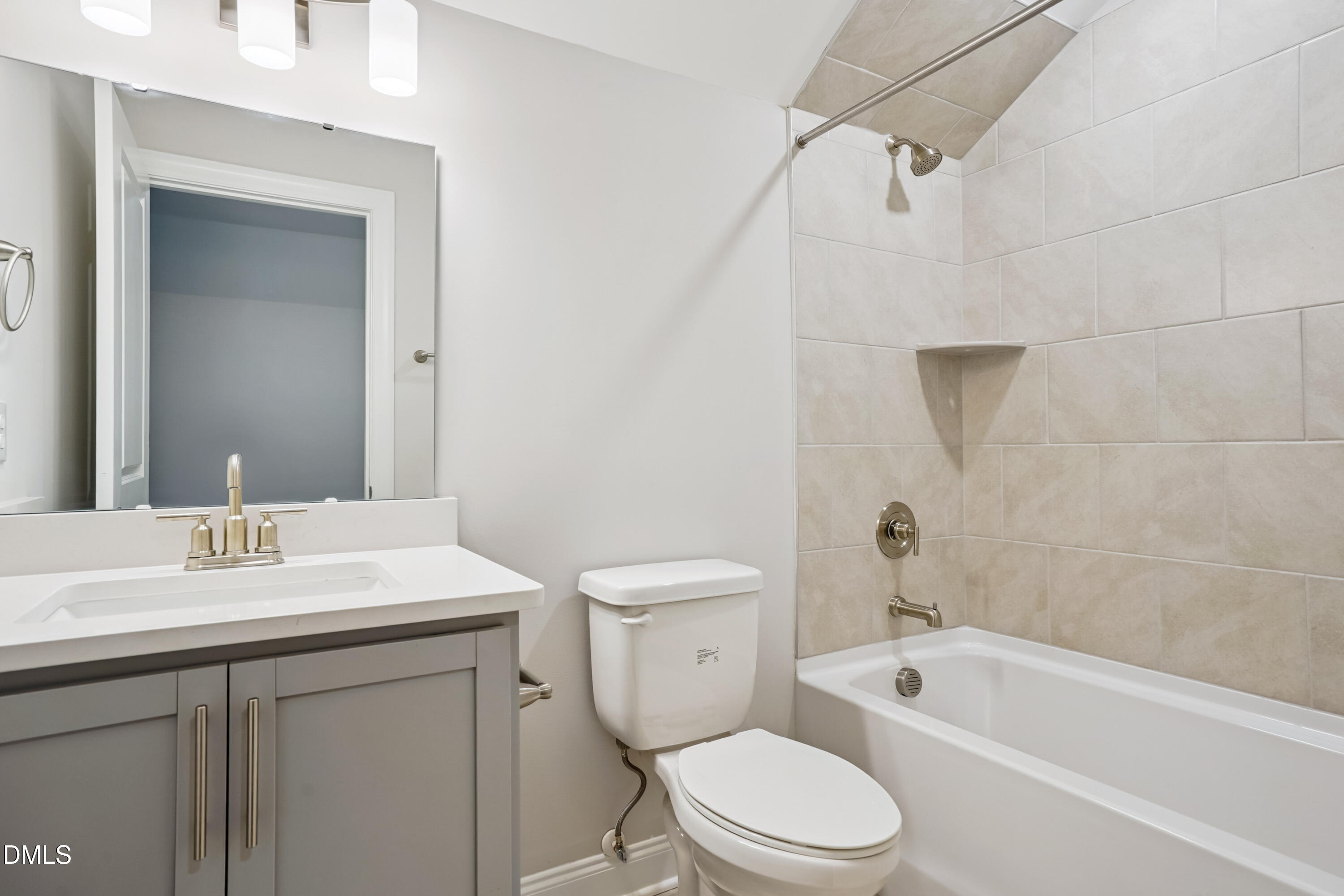 4921 Theater Way Raleigh, NC 27604 - Photo 3 of 26 a bathroom with a sink a toilet and shower
