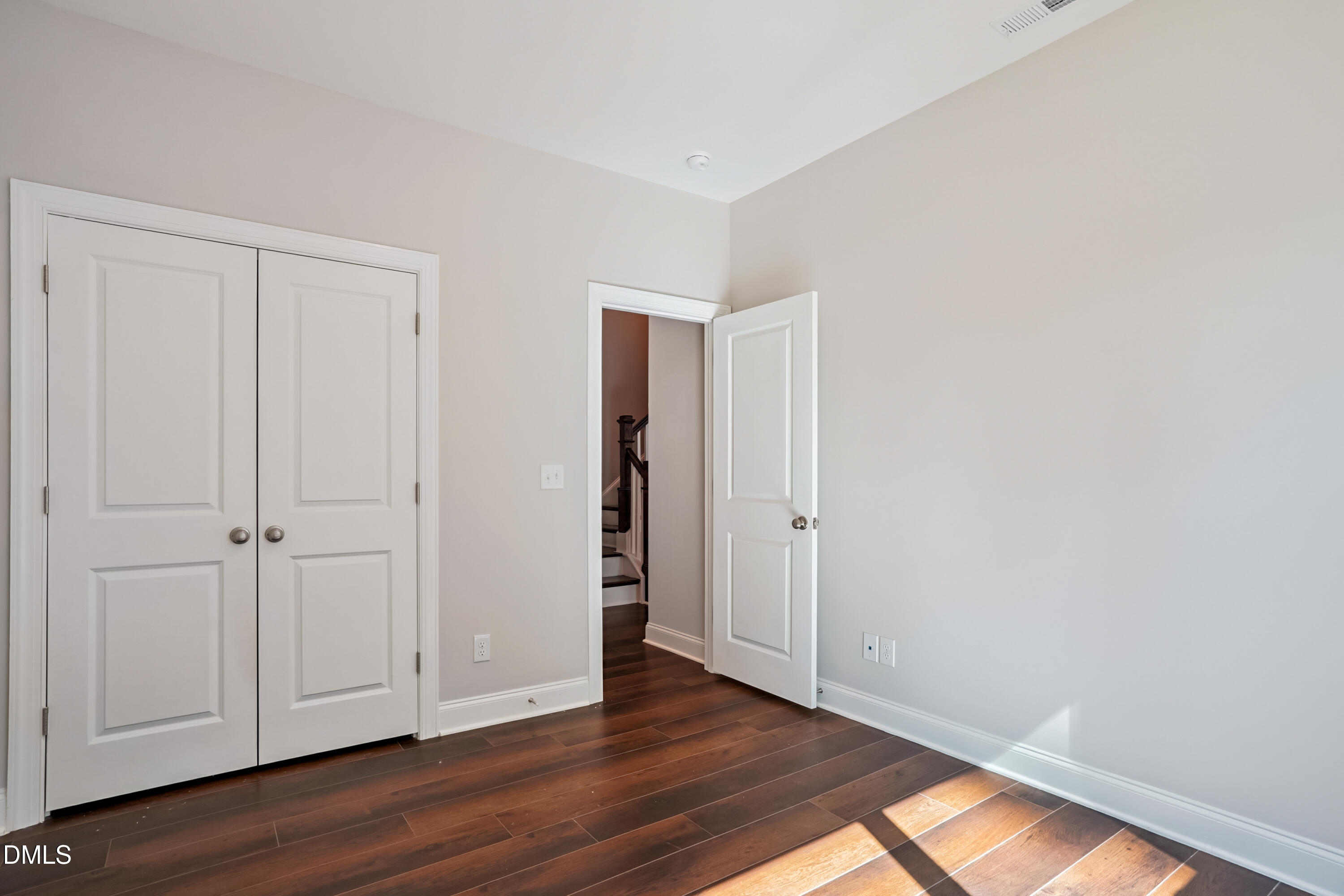 4921 Theater Way Raleigh, NC 27604 - Photo 6 of 26 a view of an empty room and wooden floor