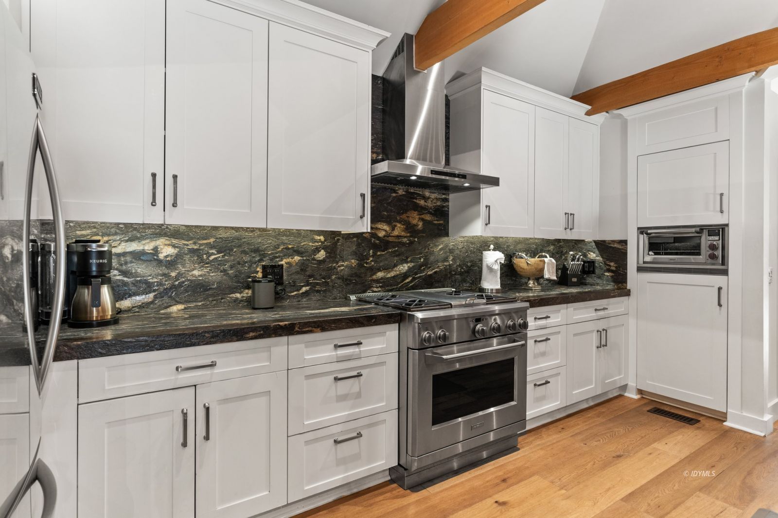25010 Tahquitz Road Idyllwild, CA 92549 - Photo 17 of 93 a kitchen with white cabinets and appliances