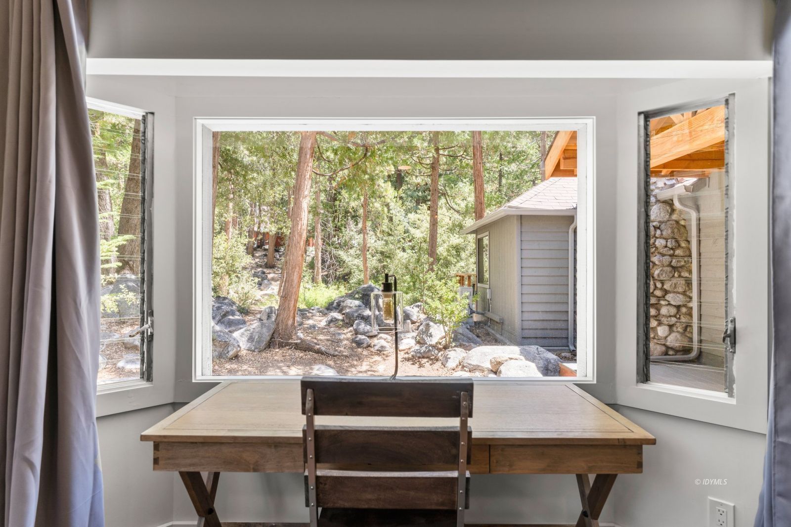 25010 Tahquitz Road Idyllwild, CA 92549 - Photo 33 of 93 a view of a dining room with furniture window and outside view
