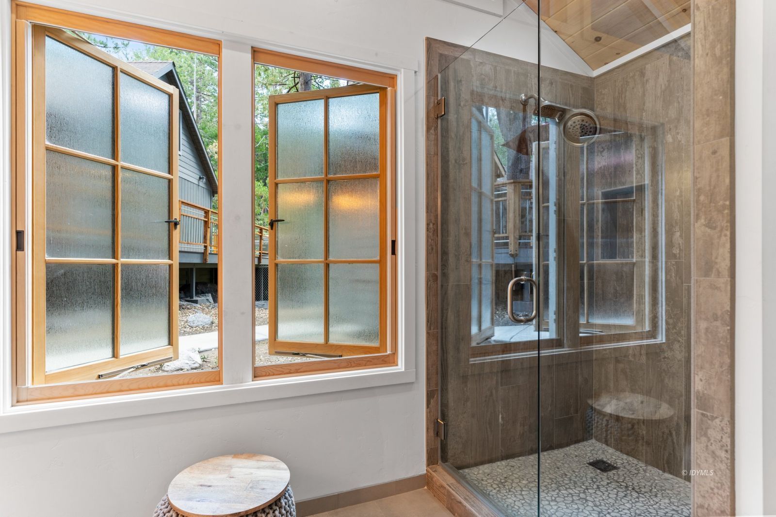 25010 Tahquitz Road Idyllwild, CA 92549 - Photo 61 of 93 a bathroom with a shower and a window