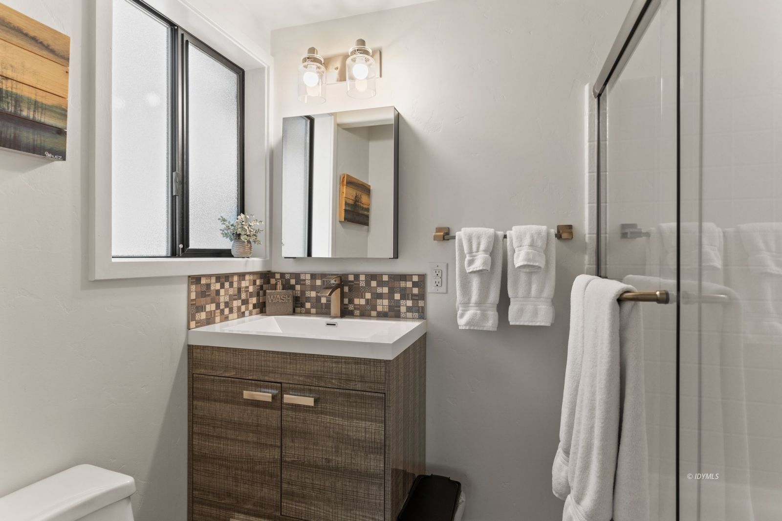25010 Tahquitz Road Idyllwild, CA 92549 - Photo 73 of 93 a bathroom with a sink a toilet and mirror