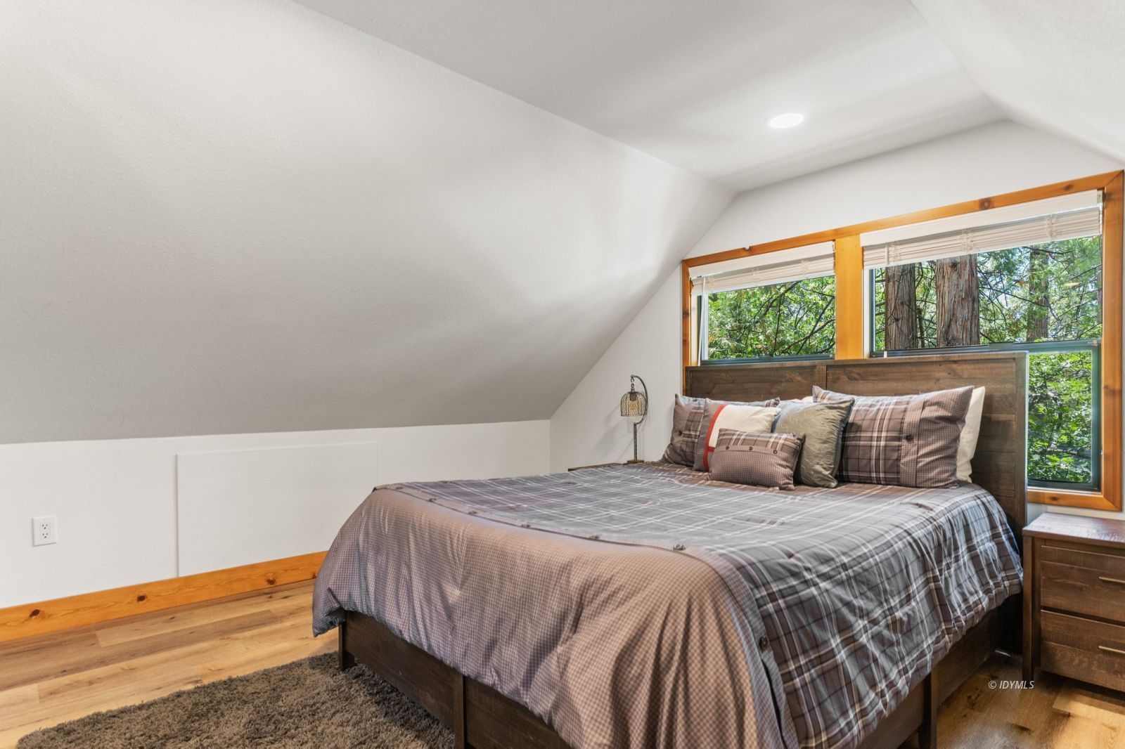 25010 Tahquitz Road Idyllwild, CA 92549 - Photo 75 of 93 a bed sitting in a bedroom next to a window
