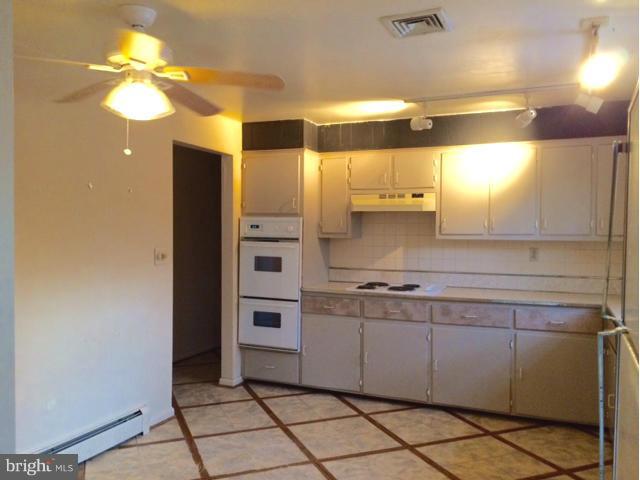 20811 Evergreen Mills Road Leesburg, VA 20175 - Photo 5 of 13 a kitchen with stainless steel appliances a sink and a refrigerator