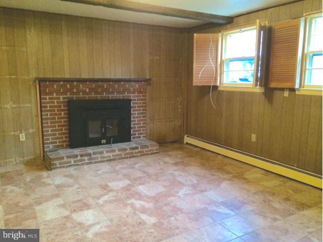 20811 Evergreen Mills Road Leesburg, VA 20175 - Photo 9 of 13 a view of an empty room with a fireplace and a window