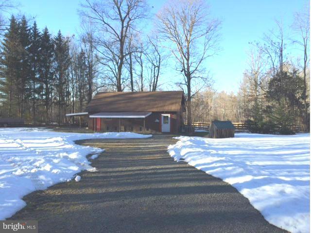 20811 Evergreen Mills Road Leesburg, VA 20175 - Photo 10 of 13 a view of a house with a snow in the yard