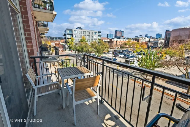 a view of a balcony with a chairs