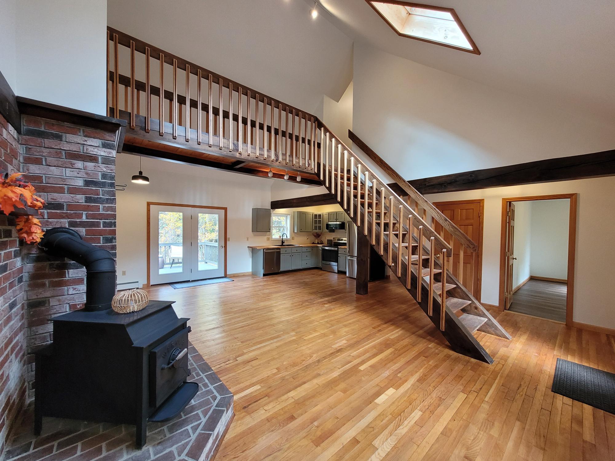 90 Old Norridgewock Road Fairfield, ME 04937 - Photo 7 of 45 Open concept with woodstove