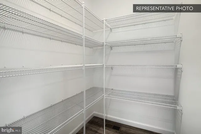 a view of an empty walk in closet