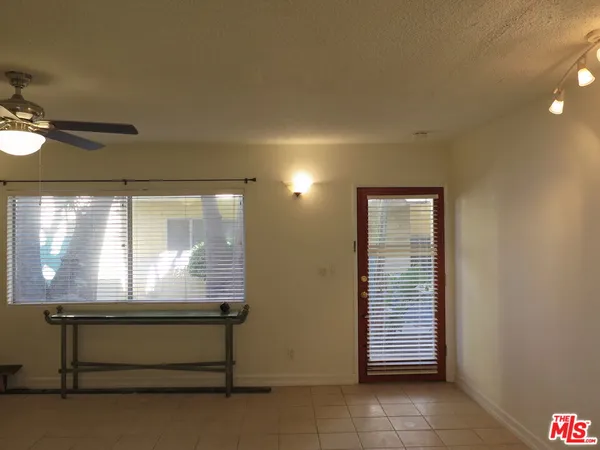 a view of room with window and furniture