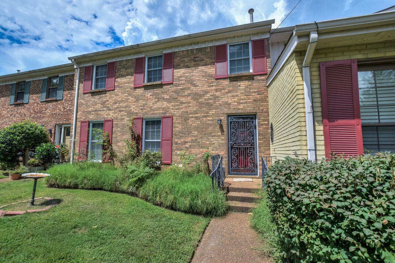4001 Anderson Road, Unit B128 Nashville, TN 37217 - Photo 1 of 21 a front view of a house with garden