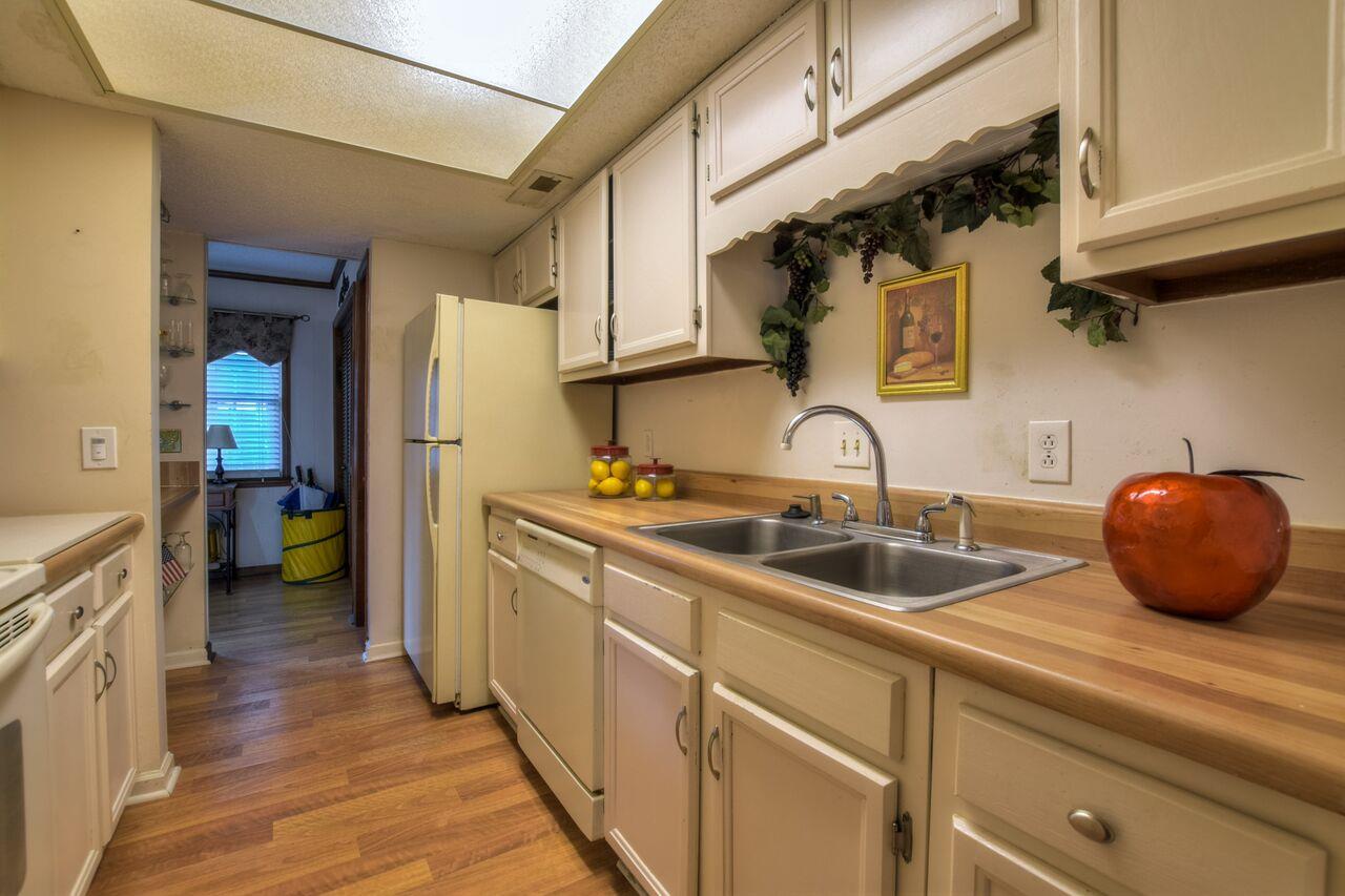 4001 Anderson Road, Unit B128 Nashville, TN 37217 - Photo 12 of 21 a kitchen with a sink and a stove