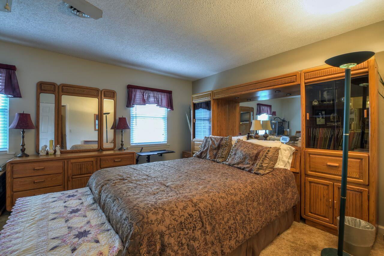 4001 Anderson Road, Unit B128 Nashville, TN 37217 - Photo 15 of 21 a bedroom with a large bed and a large window