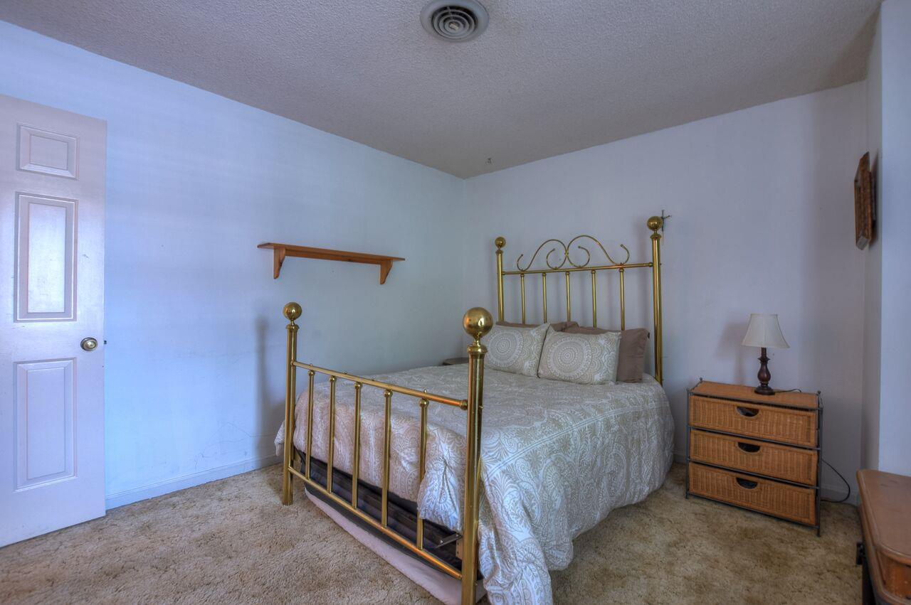 4001 Anderson Road, Unit B128 Nashville, TN 37217 - Photo 19 of 21 a bedroom with furniture and a baby crib