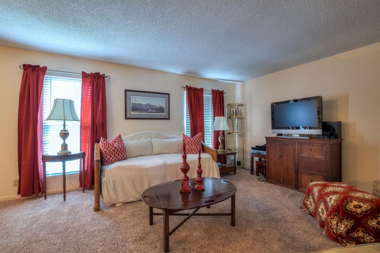 4001 Anderson Road, Unit B128 Nashville, TN 37217 - Photo 7 of 21 a living room with furniture and a flat screen tv