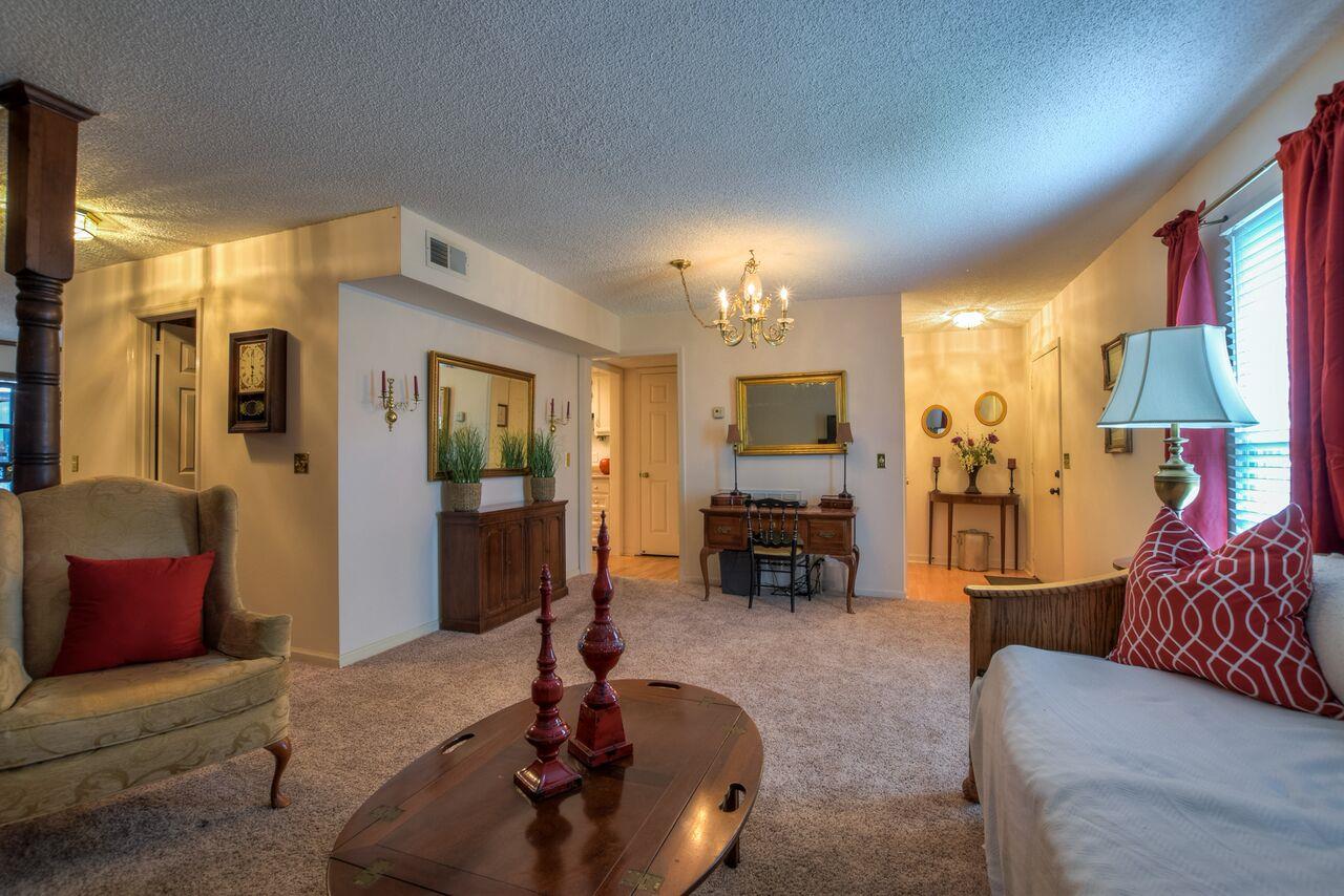 4001 Anderson Road, Unit B128 Nashville, TN 37217 - Photo 8 of 21 a living room with furniture and a flat screen tv