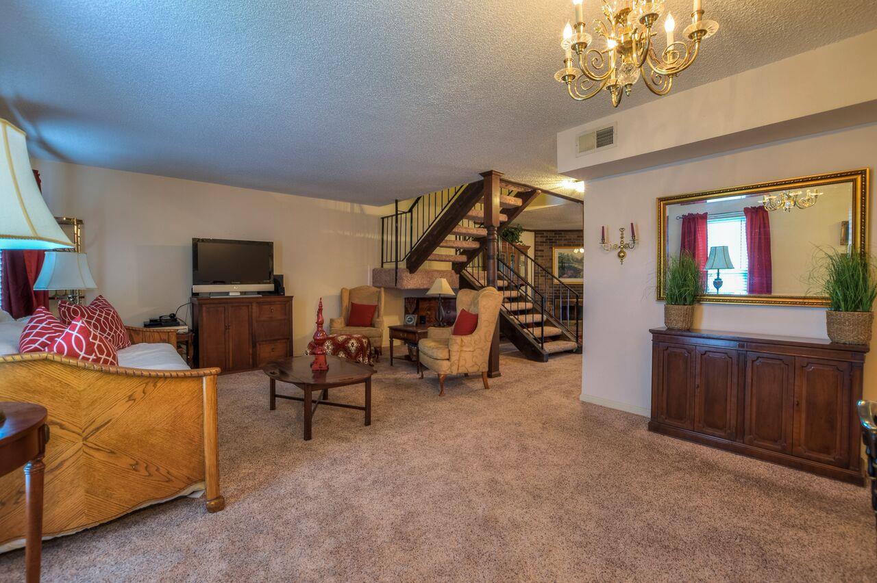 4001 Anderson Road, Unit B128 Nashville, TN 37217 - Photo 9 of 21 a view of a livingroom with furniture and a flat screen tv