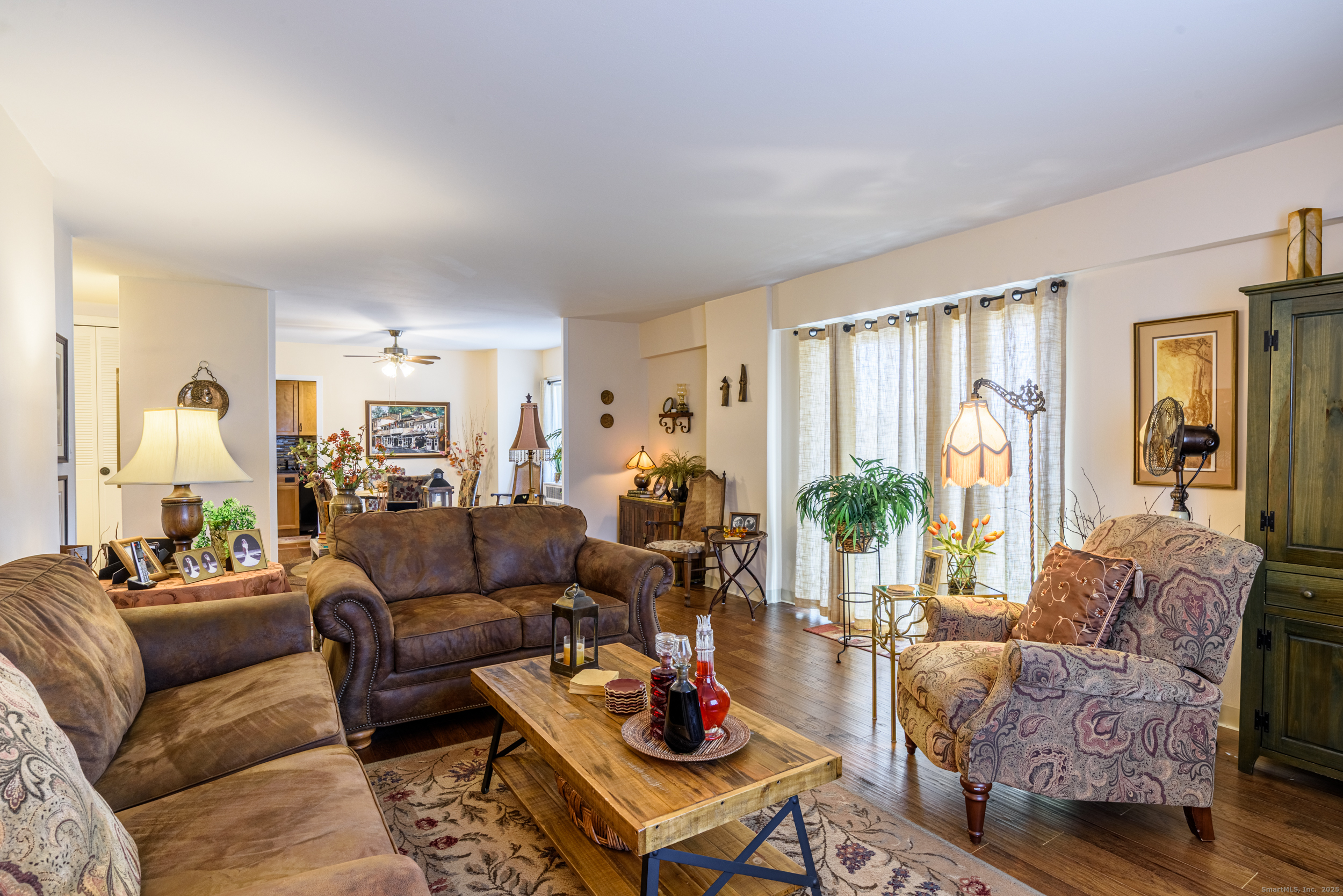80 Cartright Street, Unit 5D Bridgeport, CT 06604 - Photo 12 of 24 a living room with furniture and a large window