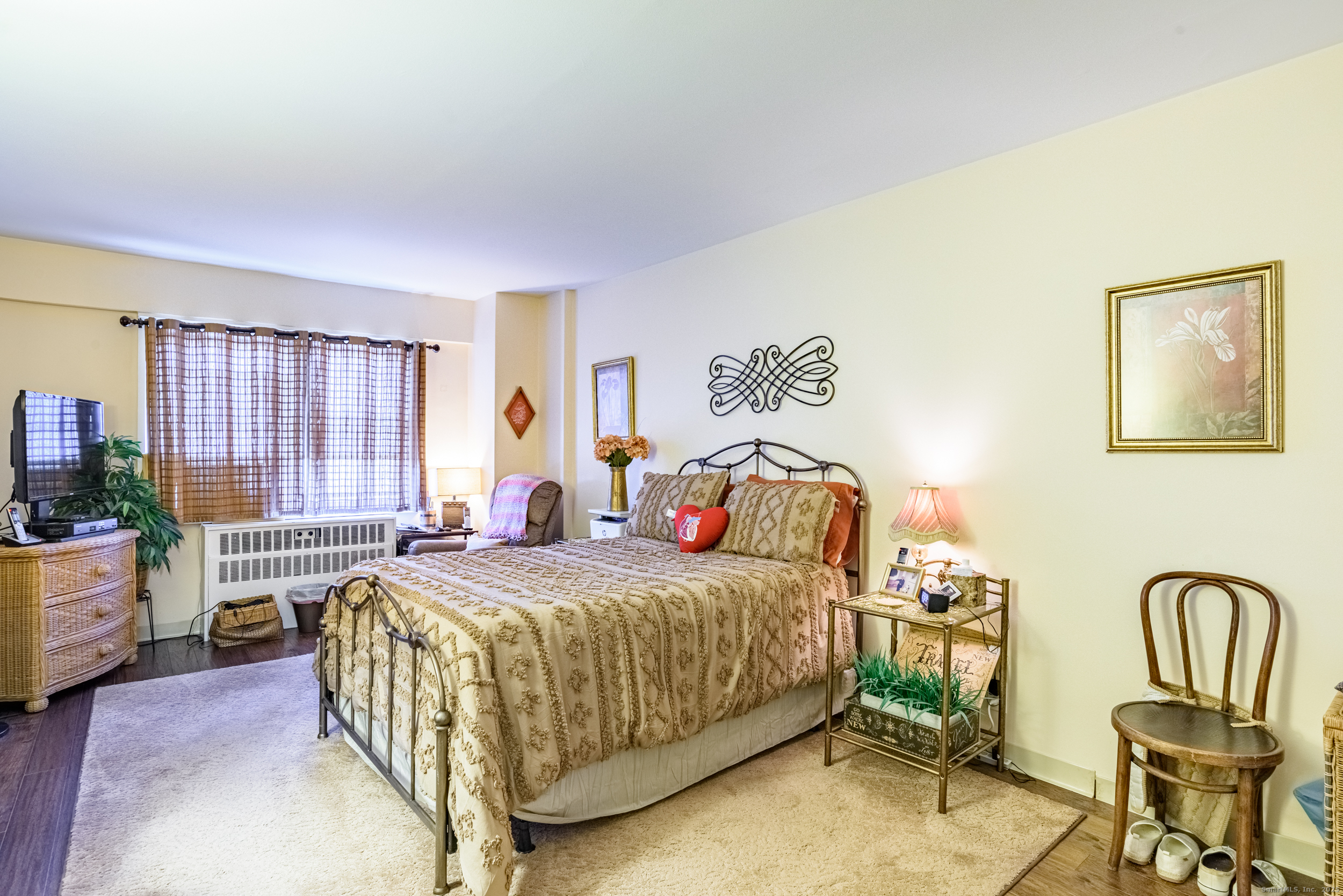 80 Cartright Street, Unit 5D Bridgeport, CT 06604 - Photo 13 of 24 a bedroom with a bed chair and a large window