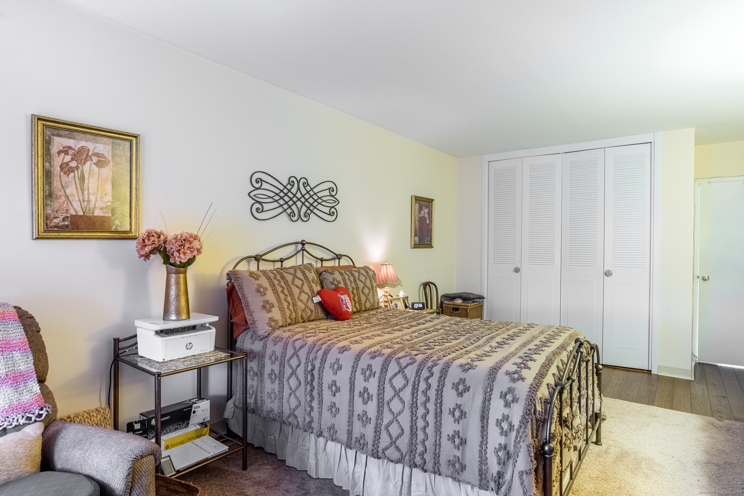 80 Cartright Street, Unit 5D Bridgeport, CT 06604 - Photo 15 of 24 a bedroom with a bed and a lamp on dresser