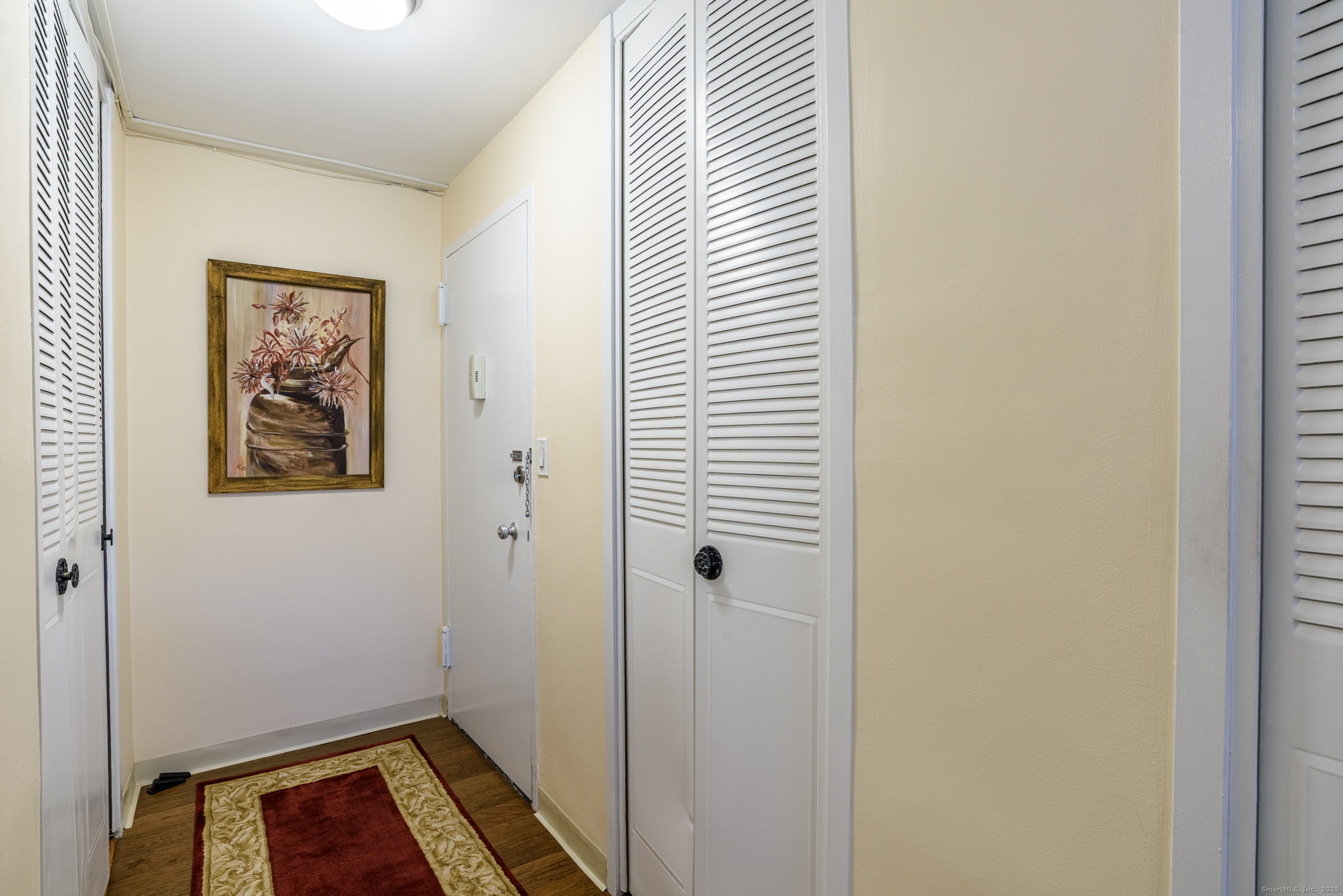 80 Cartright Street, Unit 5D Bridgeport, CT 06604 - Photo 16 of 24 a view of room with window and wooden floor
