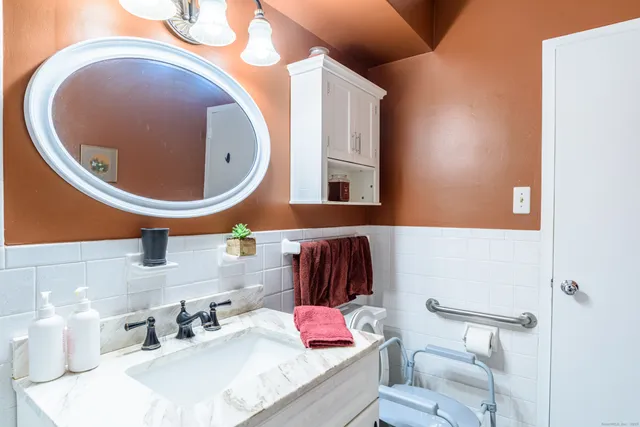 a bathroom with a sink and mirror