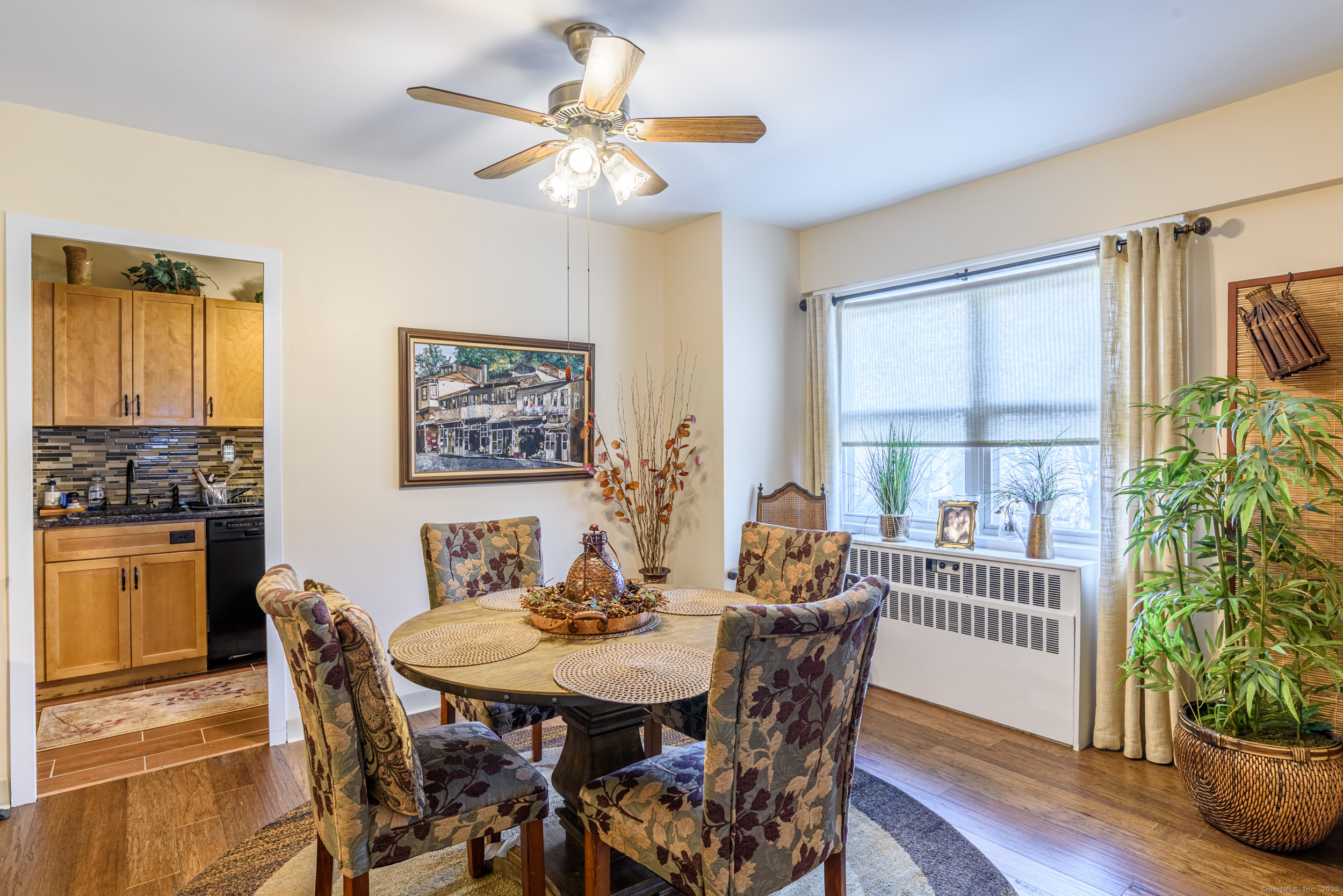 80 Cartright Street, Unit 5D Bridgeport, CT 06604 - Photo 5 of 24 a view of a dining room with furniture window and wooden floor