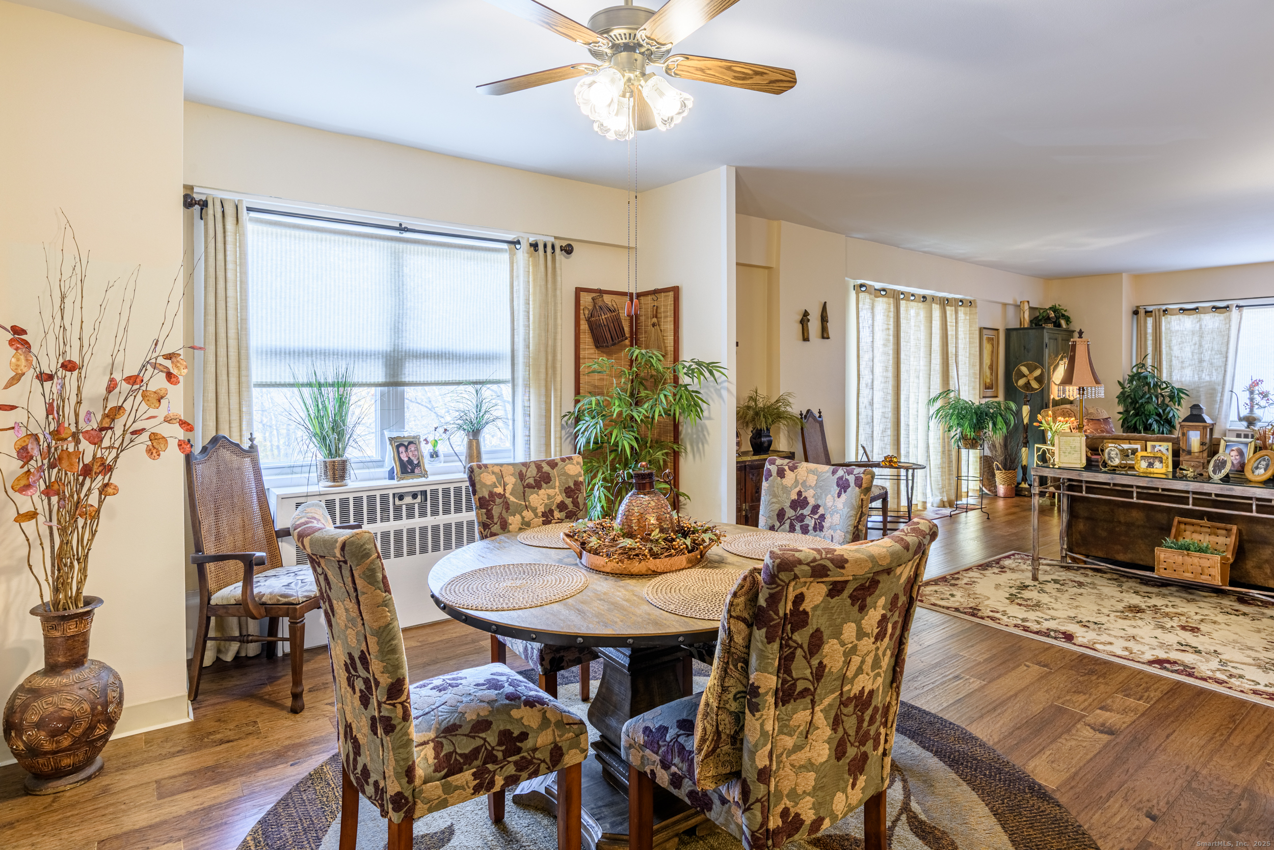 80 Cartright Street, Unit 5D Bridgeport, CT 06604 - Photo 7 of 24 a view of a dining room with furniture and wooden floor