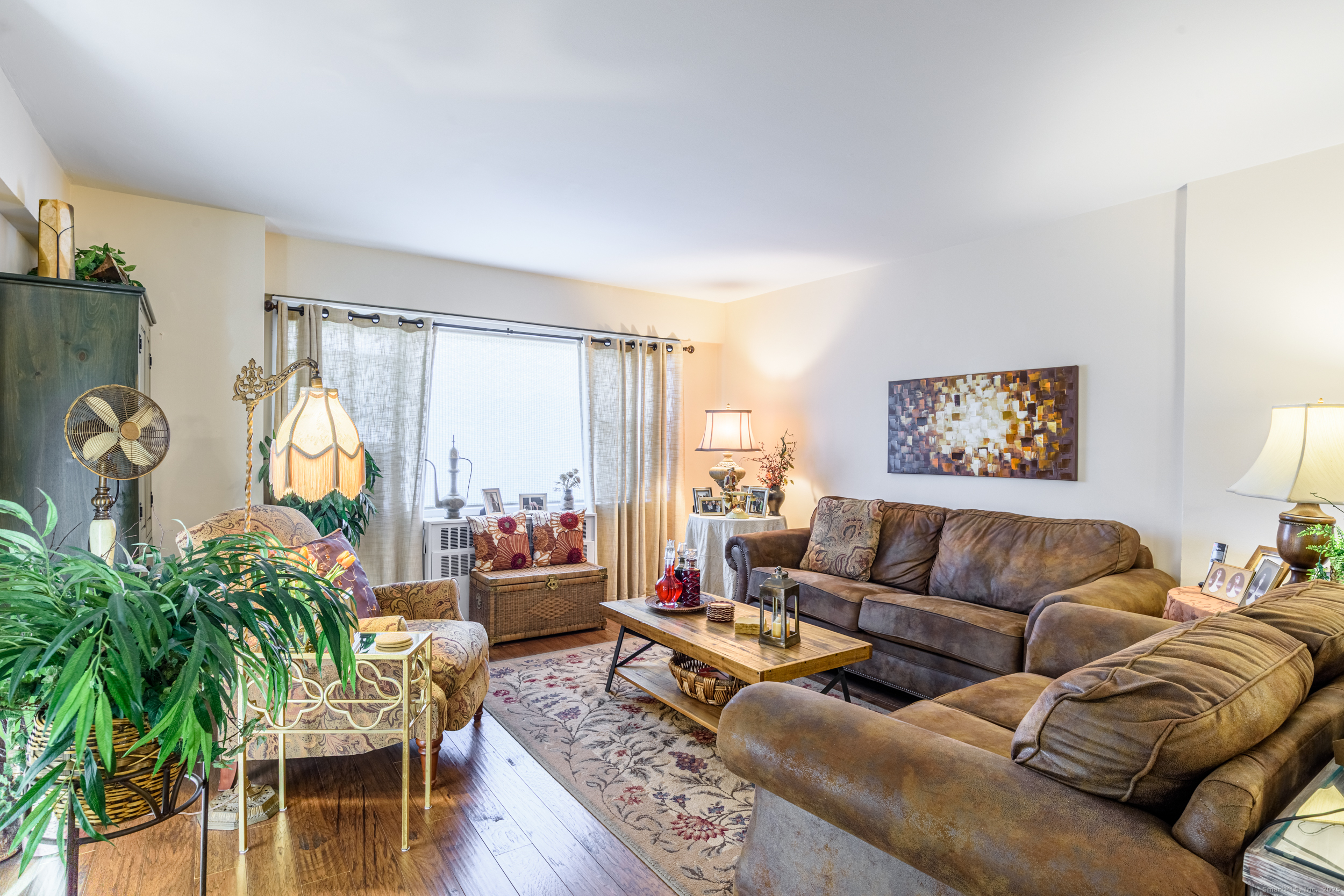 80 Cartright Street, Unit 5D Bridgeport, CT 06604 - Photo 10 of 24 a living room with furniture and a large window