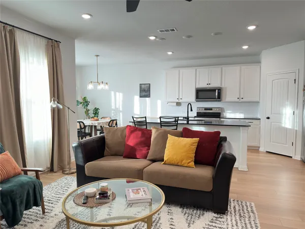 a dining room with furniture and window