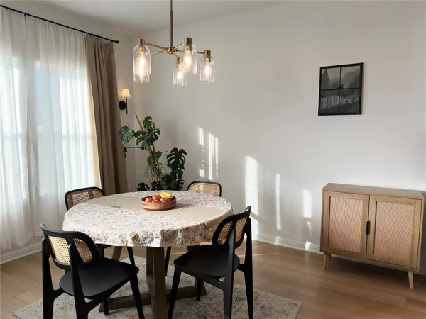 a kitchen with kitchen island granite countertop a stove a sink and a refrigerator
