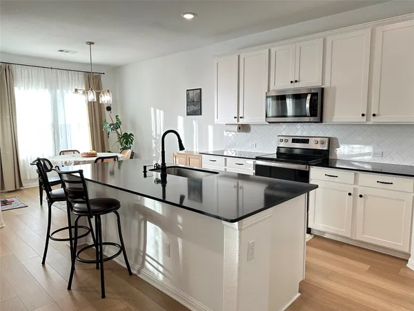 a bedroom with a bed and a desk