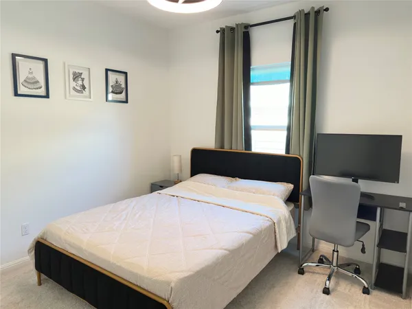 a bathroom with double vanity sink and two mirror