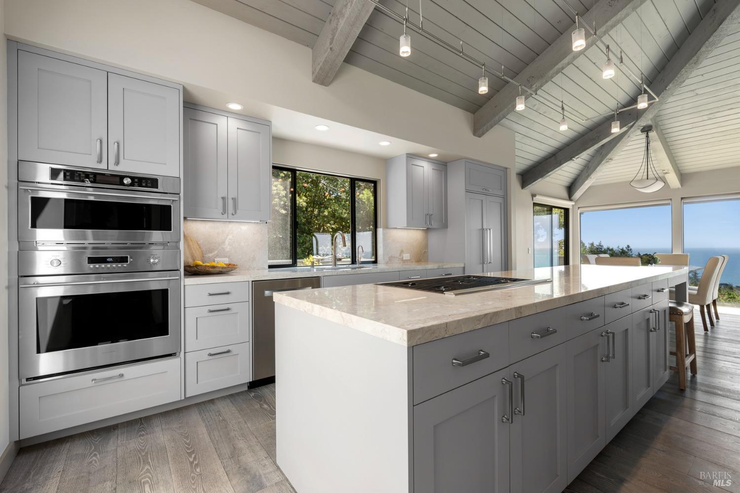 Undisclosed Address The Sea Ranch, CA 95497 - Photo 5 of 46 a kitchen with stainless steel appliances a stove sink and microwave