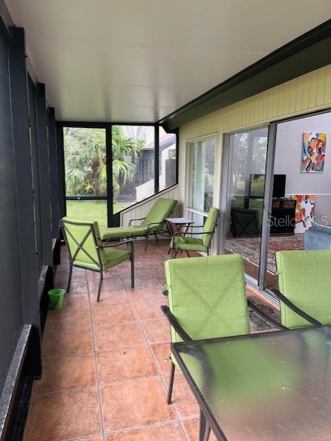 716 White Pine Tree Road, Unit 79 Venice, FL 34285 - Photo 11 of 22 a living room with furniture and a large window