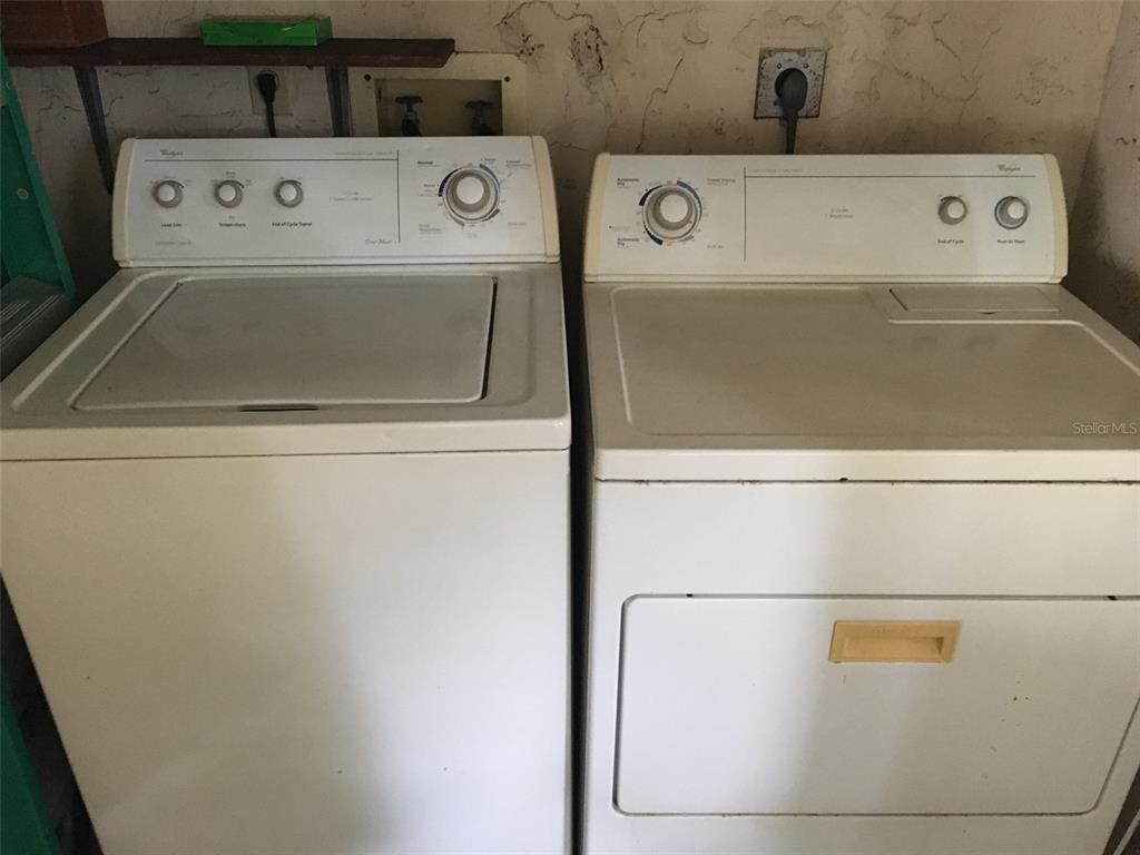 716 White Pine Tree Road, Unit 79 Venice, FL 34285 - Photo 16 of 22 a utility room with dryer and washer
