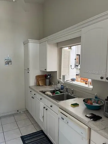 a kitchen with a sink and cabinets