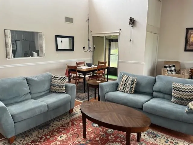 a living room with furniture and a rug