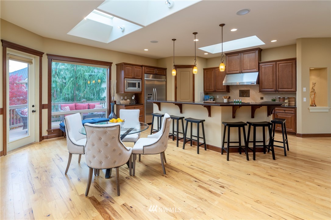 1710 Kitsap Place Northeast Renton, WA 98059 - Photo 14 of 37 a view of a dining room with furniture window and outside view