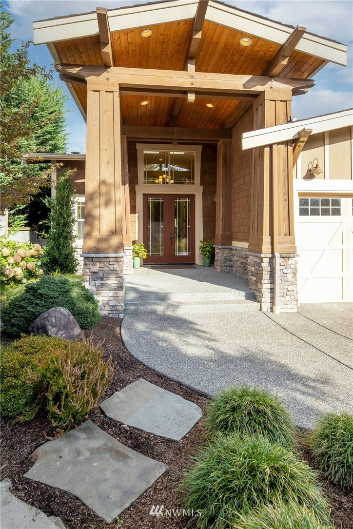 1710 Kitsap Place Northeast Renton, WA 98059 - Photo 3 of 37 a view of a house with a patio and a yard