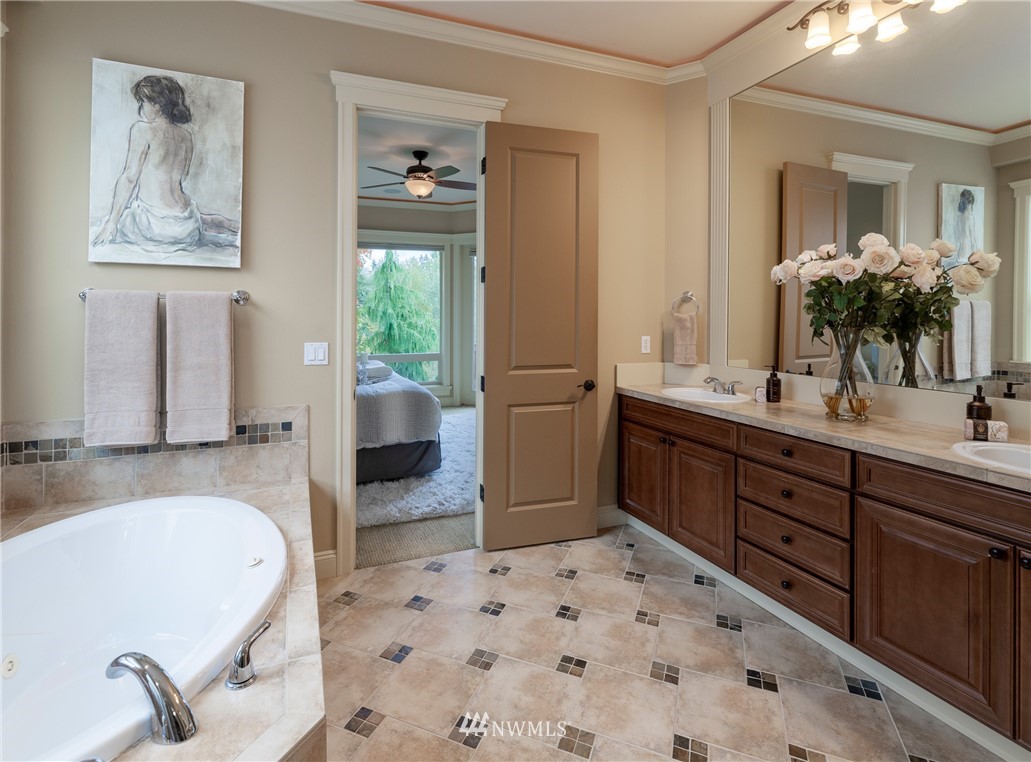 1710 Kitsap Place Northeast Renton, WA 98059 - Photo 22 of 37 a spacious bathroom with a tub sink and mirror