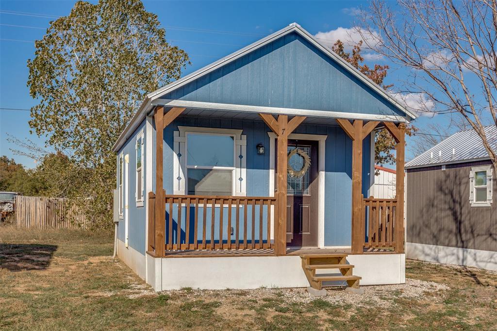 5001 Knob Hill Road, Unit D2D5 Azle, TX 76020 - Photo 1 of 16 a view of a house with wooden fence and large windows