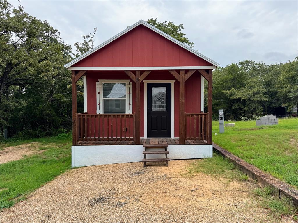 5001 Knob Hill Road, Unit D2D5 Azle, TX 76020 - Photo 16 of 16 a front view of a house with garden
