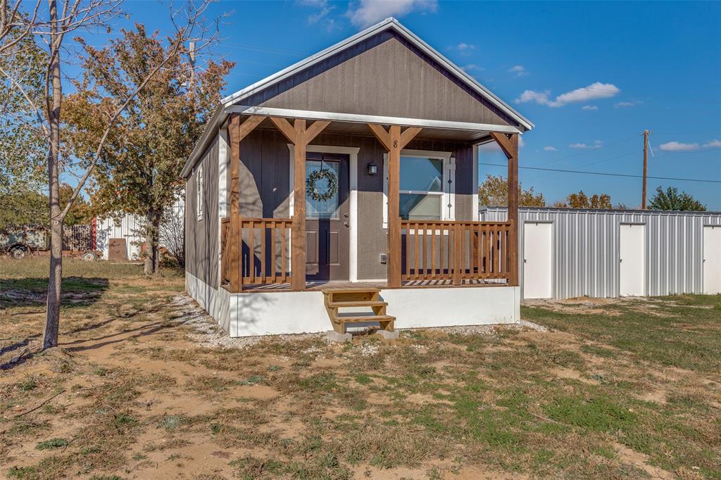 5001 Knob Hill Road, Unit D2D5 Azle, TX 76020 - Photo 2 of 16 a front view of a house with a yard