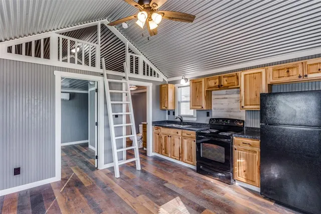 a kitchen with stainless steel appliances granite countertop a stove and a refrigerator