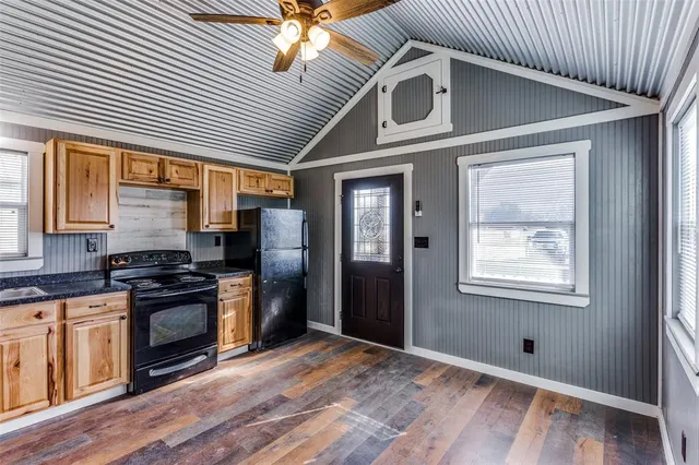 a kitchen with stainless steel appliances granite countertop a stove and a refrigerator