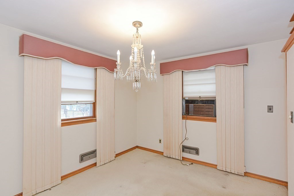 209 3rd Street Stoughton, MA 02072 - Photo 11 of 36 a view of a livingroom with wooden floor and windows