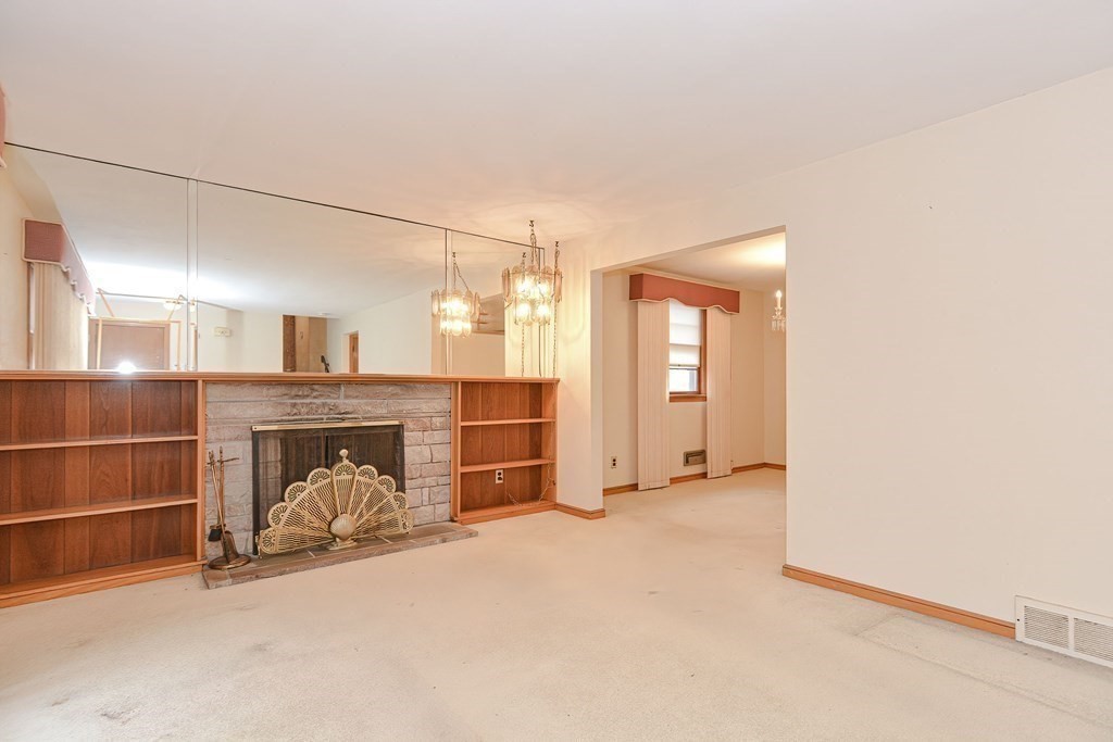 209 3rd Street Stoughton, MA 02072 - Photo 13 of 36 a view of a livingroom with a furniture and a ceiling fan